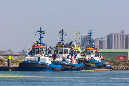 Hoek van Holland, Rotterdam, the Netherlands - 9 April 2017: tug boarts berthed in the dock of...