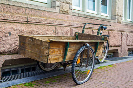 Amsterdam, the Netherlands - 13 August 2017: wooden handcart built on bicycle frame for transporting goods through Amsterdamのeditorial素材