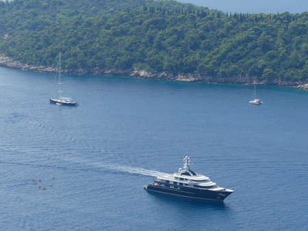 Otok Lokrum island, Croatia - August 3 2018: high panoramic view of luxury yachts around Otok Lokrum island near Dubrovnikのeditorial素材