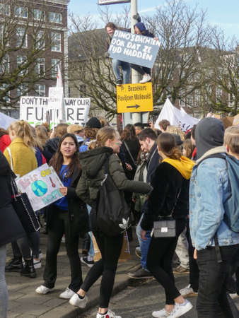The Hague, the Netherlands - February 7 2019: students at anti climate change protest in The Hague with banners walking through the cityのeditorial素材