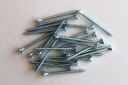 screw close-up macro photo, white background, metal screw, steel screw, screw macro, repair screw