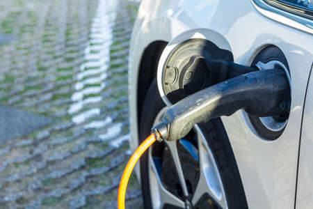 Kijkduin, the Netherlands - September 15 2018: Tesla electric car charging batteries at plug in charge station in the Netherlandsのeditorial素材