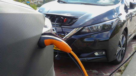 Kijkduin, the Netherlands - September 15 2019: Tesla electric car charging batteries at plug in charge station in the Netherlandsのeditorial素材