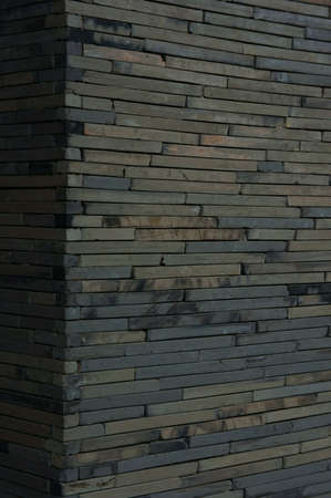 Concrete slabs tile up as solid wall                   の写真素材