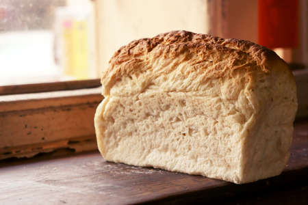 A traditional South East Asia bread sitting in front of window             