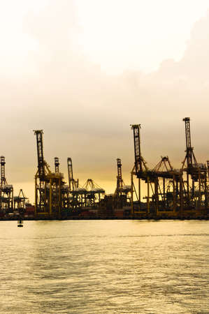 Vertical view of a Harbor with a golden sunset view- Singapore の写真素材