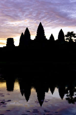 Angkor Wat silhouette during sunrise with water reflectionの写真素材