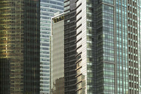 Close up of a cluster of modern glass buildingsの写真素材