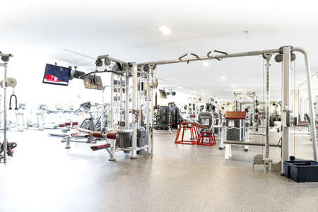 An interior shot of a club gym with all the execrise equipmentsの写真素材