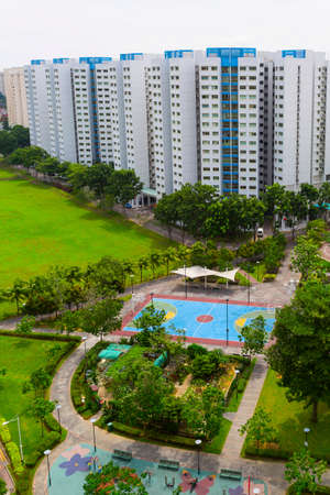 A new colorful neighborhood estate with tennis court and playground  の写真素材