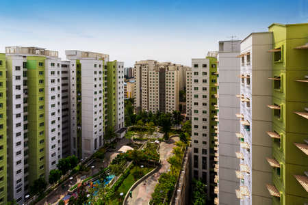 High angle shot of a residential estate with carpark, garden and playgroundの写真素材