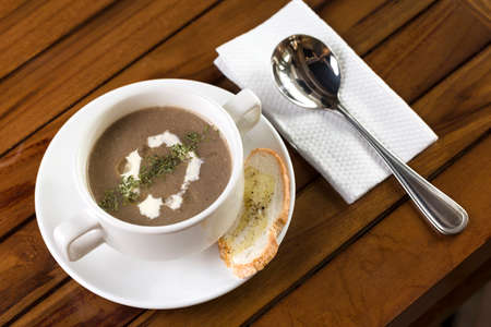 A cup of mushroom soup ready to be served の写真素材