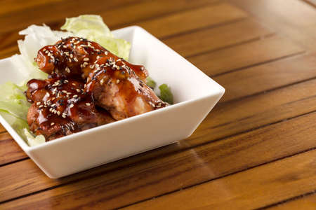 Barbecue buffalo wings with sesame sauce ready to be served.の写真素材