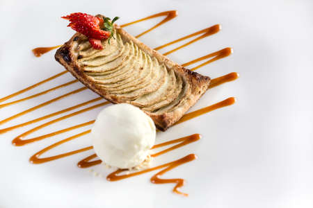 Strawberry biscuit dessert ready to be served with vanila icecream isolated in white.の写真素材