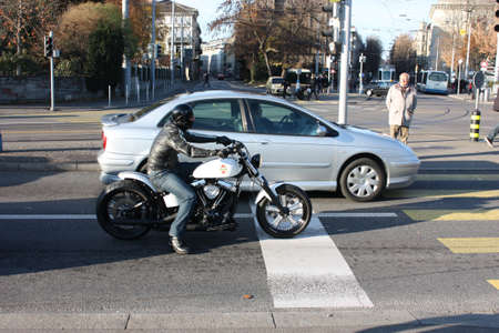 Zurich, Switzerland - November 27, 2011. Motorcyclist biker stopped at an intersectionのeditorial素材