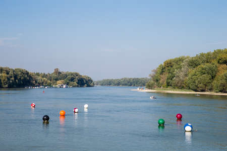 River views to the horizon. A wide calm river and floating on it billiard balls.の写真素材