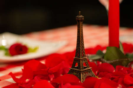 Eiffel tower on red petals with unfocused backgroundの写真素材