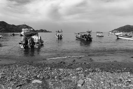 Port in the coastal bay with several small fishing boats with the seaの写真素材