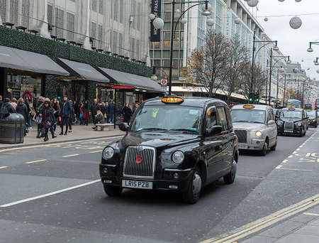 LONDON, UNITED KINGDOM - NOVEMBER 25, 2018: London Taxi, called hackney carriage, black cab in Piccadilly Circusのeditorial素材