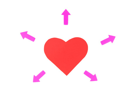 One red paper heart with two pink arrows directed in different directions isolated on white background, concept of love relationshipsの写真素材