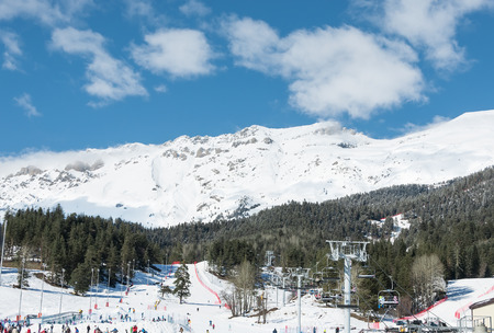 Panorama of ski resort Arkhyz, skiers and cable carの写真素材