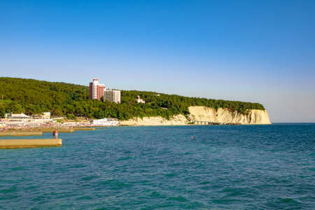 View from the sea in a seaside town and the mountainsの写真素材