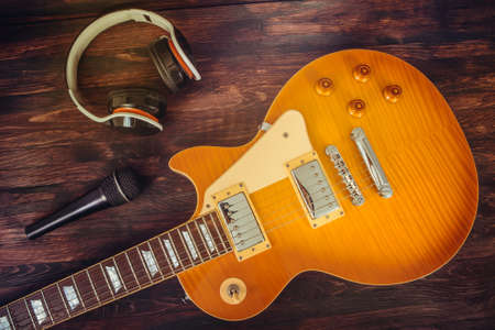 sunburst guitar, headphone and microphoneの写真素材