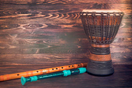 flute and drum on wooden backgroundの写真素材