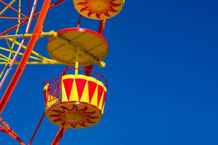 Ferris wheel against the blue sky. The cockpit of the Ferris wheel close-upの写真素材
