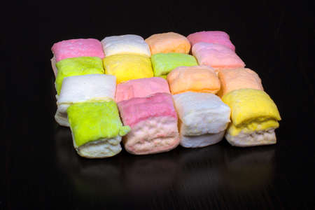 multicolored marshmallow on a black background, close-upの写真素材