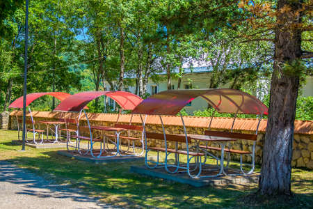 Arbors in the summer Park. Covered red gazebos.の写真素材