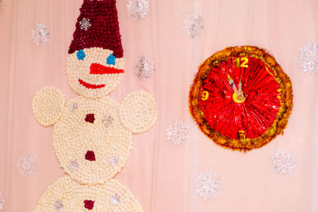 Snowman and clock. Winter decorative Christmas background.