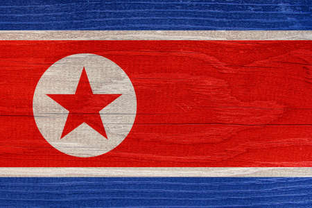 North Korean flag with wood texture. North Korea flag on wooden texture