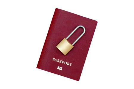 Passport and padlock. Ban on leaving the country. Travel abroad is closed. Passport with a lock on a white backgroundの写真素材