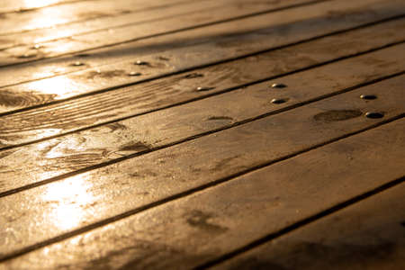 A plank floor on which sunlight fallsの写真素材