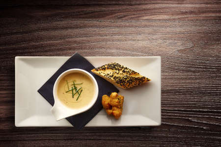 Directly above photograph of a stylish Nouvelle Cuisine bowl of cream soupの写真素材
