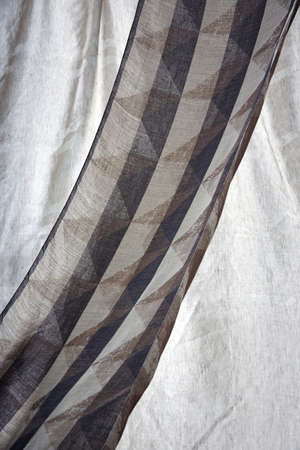 Shot of grey color armchair with pillow on hardwood floorの写真素材