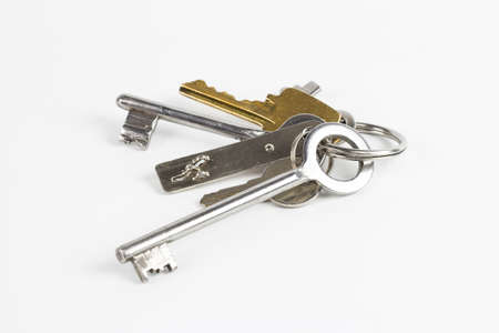 Six keys of different kind photographed on white background