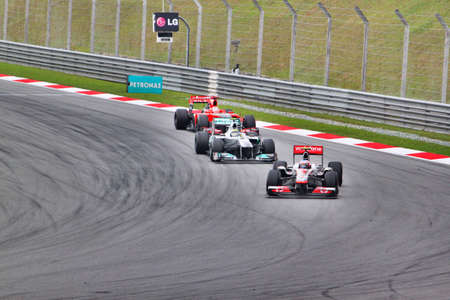 F1 cars entering a cornerの素材