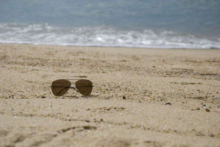 Sunglasses, black shades on beachの写真素材