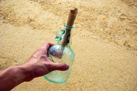 Picking up message in the bottleの写真素材