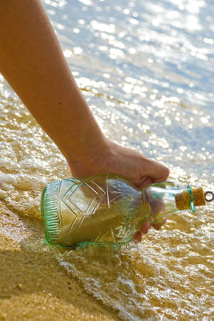 Picking up message in the bottleの写真素材