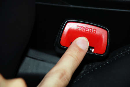 Press, unbuckle - risky business concept shot