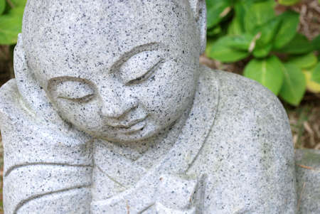 Serene peaceful buddhist monk statueの写真素材