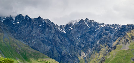 Georgian snowy mountains in the cloudsの写真素材