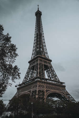 Autumn, cloudy Eiffel Tower in Paris, in the evening without lightingの写真素材