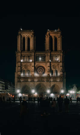 Paris, France - November 04, 2021: Night Notre Dame frontal vertical photoのeditorial素材