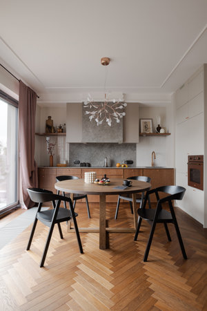 Furniture set in a dining room with hardwood flooring and table and chairsの写真素材