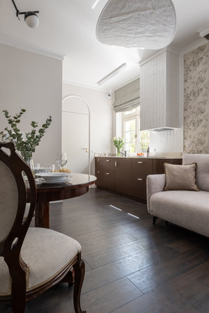 A living room with furniture like a couch, table, and chairsの写真素材