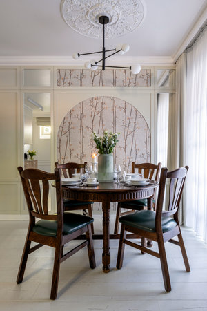 Furniture set with table, chairs, chandelier in buildings dining roomの写真素材